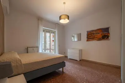 a bedroom with a bed and a window at GuestHost - Trastevere Apartment Roma Portuense in Rome
