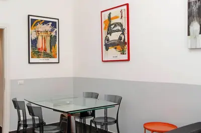 a dining room with a glass table and chairs at Neo Urbis Art Aparts in Rome