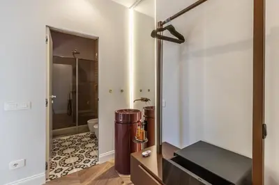 a bathroom with a shower and a toilet in a room at Porta Trastevere Palace in Rome