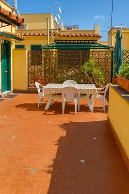 a table and two chairs sitting on a patio at Cola di Rienzo Attico & Charme - by 101 Flats in Rome