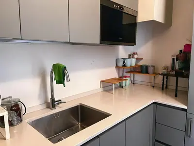 a kitchen counter with a sink and a microwave at Stay by the Pantheon in the Heart of Historic Rome in Rome