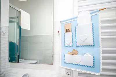 a bathroom with a towel rack with hearts on it at Il Pianoforte di Teresa - appartamento a Monteverde in Rome