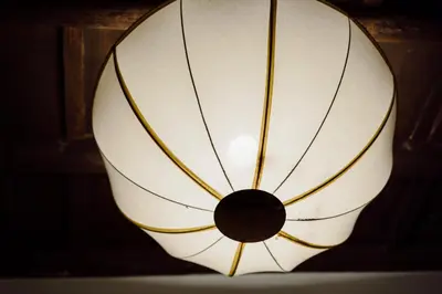 a close up of a lamp with a white shade at The Oasis of Trastevere in Rome