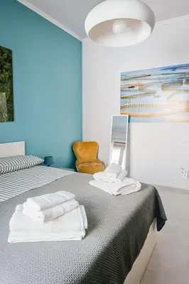 a bedroom with a bed with towels on it at Casa Chanel in Rome