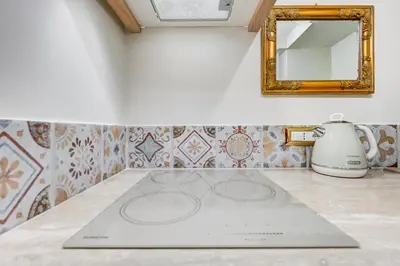 a counter top with a mirror and a blender at Trastevere Liberty House in Rome