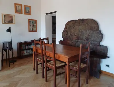a dining room with a wooden table and chairs at Del Cinque Heritage - Charme Holidays in Rome