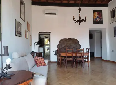 a living room with a couch and a table at Del Cinque Heritage - Charme Holidays in Rome