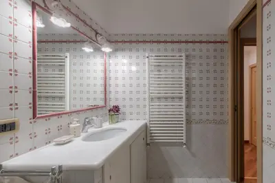 a bathroom with a sink and a mirror at iFlat Vintage Retreat - Comfort in Central Rome in Rome