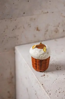 a small cupcake sitting on a white ledge at Hotel Trame in Rome