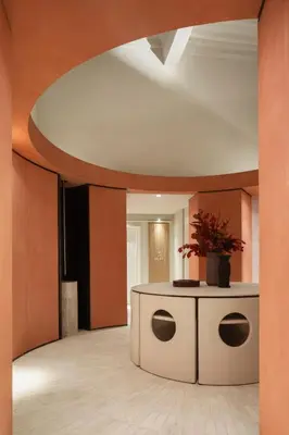 a lobby with a circular ceiling and a table with a plant on it at Hotel Trame in Rome