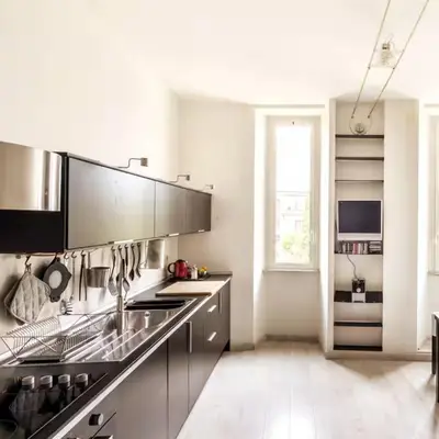 a kitchen with stainless steel appliances and a window at Monastery's View Home in Rome