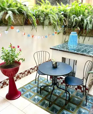 a table and chairs sitting on a patio at Casa Mirella near Piazza Navona, Rooftop Views in Rome