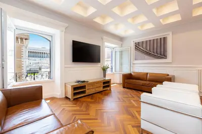 a living room with a couch and a tv at Amazing Vittoriano in Rome