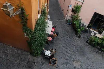 an overhead view of a street with tables and chairs at Casa Mia Trastevere in Rome