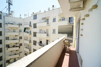 a balcony of a building with white apartments at Blue Apartment Testaccio & Trastevere in Rome