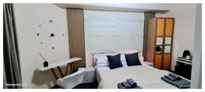 a bedroom with a white bed and a window at Wanderlust Suite in Rome