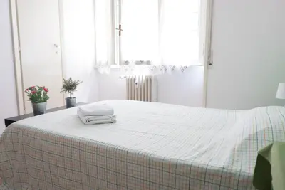 a bed with two towels sitting on top of it at Next Stop Roma Affittacamere Casilino in Rome