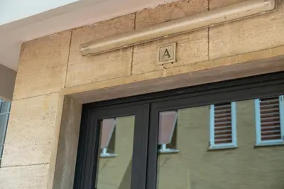 a building with a sign on the side of it at Andy Home in Rome