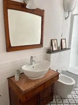 a bathroom with a sink and a toilet at Apartment Sora Marcella, Testaccio in Rome