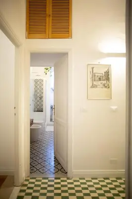a hallway with a bathroom with a toilet at Apartment Sora Marcella, Testaccio in Rome