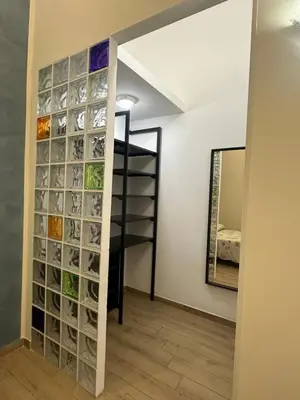 a room with a wall of glass wine bottles at Marcelina Holidays in Rome
