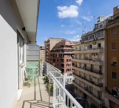 a balcony with a view of some buildings at Yasmine Luxury Apartment in San Giovanni in Rome