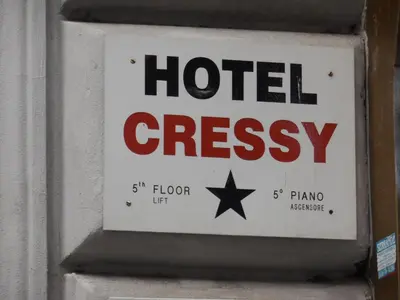 a sign for a hotel crossasy on a wall at Cressy in Rome