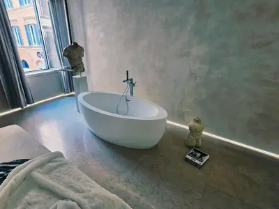 a bathroom with a white tub in a room at DUNE at Spanish Steps Luxury Apartment-Suite in Rome