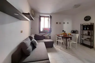 a living room with a couch and a table at Eat Pray Stay Pantheon in Rome