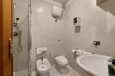 a bathroom with a toilet and a sink at Eat Pray Stay Pantheon in Rome