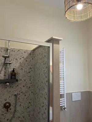 a bathroom with a shower with a glass door at CasaCoco con posto auto e 2 bagni in Rome