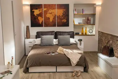 a bedroom with a bed with a map on the wall at Rome's heart in Rome