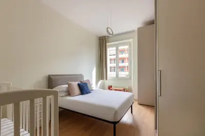 a small bedroom with a bed and a window at Casa Giuliana 91 by Hili in Rome