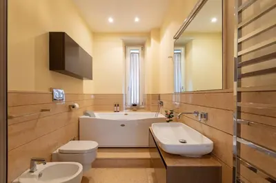 a bathroom with a sink and a toilet and a tub at Casa Giuliana 91 by Hili in Rome