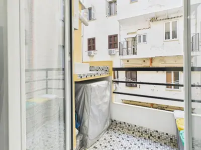 a balcony with a view of a building at Esquilino Refined Holiday Home in the Heart of Rome in Rome