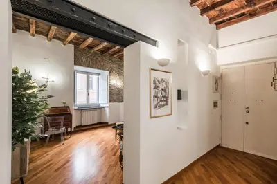 an apartment with white walls and wooden floors at The Best Rent - Characteristic three-room apartment near Piazza Navona in Rome