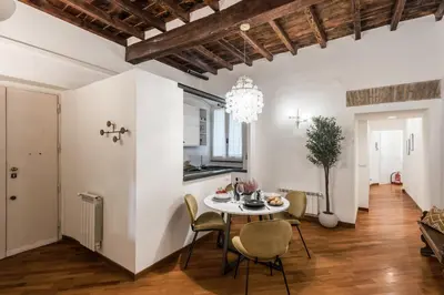 a dining room with a table and chairs at The Best Rent - Characteristic three-room apartment near Piazza Navona in Rome