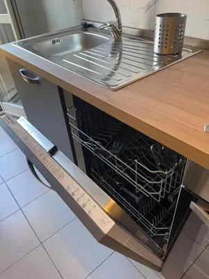 a dishwasher in a kitchen with a sink at Gemelli Roma House Apartment in Rome
