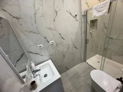 a bathroom with a sink and a shower at Mellini Escape in Rome