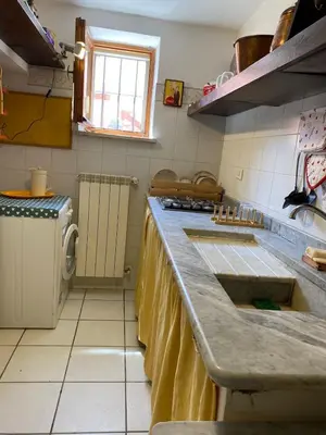 a kitchen with a counter top and a sink at The Pilgrim's Court in Rome