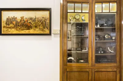 a wooden cabinet with a picture of a painting of a painting oforationxual at Trastevere Decò Apartment in Rome