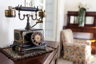 an old fashioned phone sitting on top of a table at Trastevere Decò Apartment in Rome