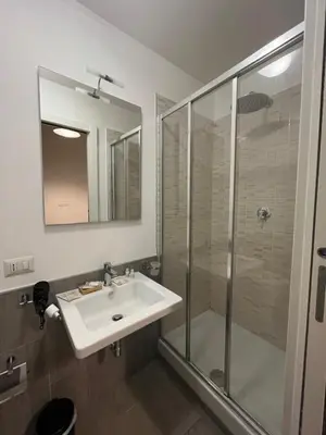 a bedroom with a bed with towels on it at Essenza House Porta Pia in Rome