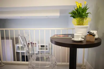 a table with a plant and a vase on it at Pia Domus in Rome