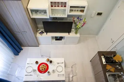 an overhead view of a kitchen with a table and a tv at Pia Domus in Rome