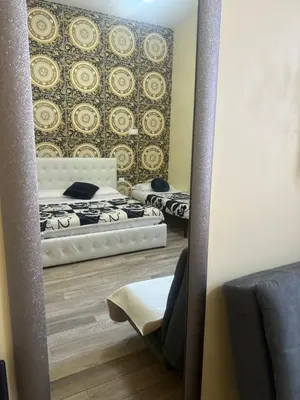 a mirror reflection of a bedroom with two beds at Lin Mare in Rome