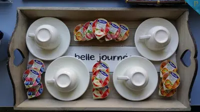 a wooden box with plates and cups and saucers at Piccolotel in Rome