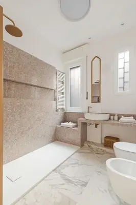 a bathroom with a sink and a tub and a toilet at Bright Family 5BR Apartment in Parioli in Rome