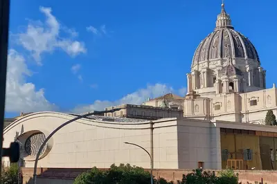 a large white building with a dome on top of it at 4BNB - St. Peters Dome Apartment in Rome