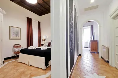 a bedroom with a bed in the middle of a hallway at Bollo in Rome